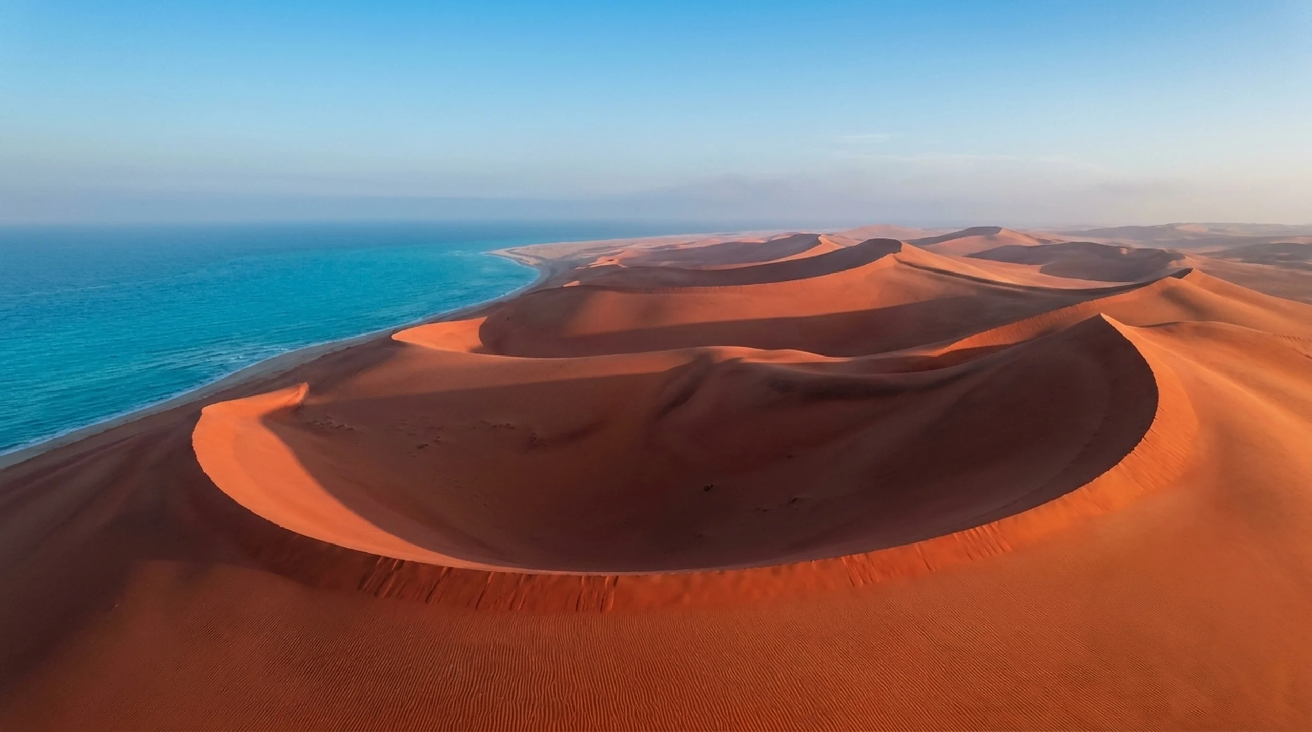 Zahek Dunes — crescent ridgelines at golden hour